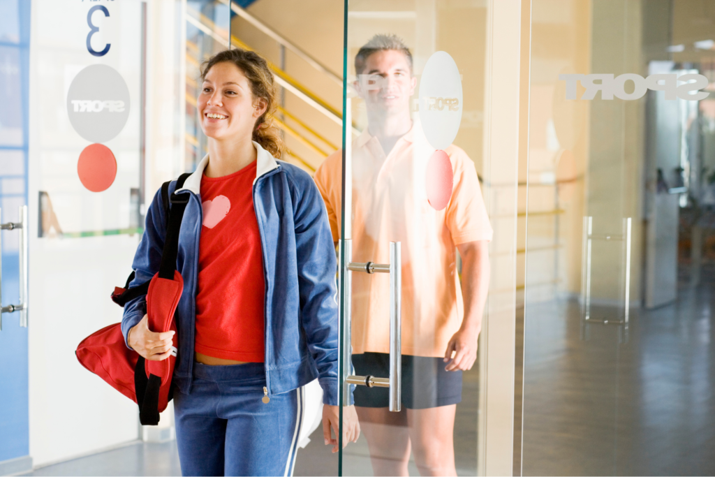 A woman walking into a gym feeling confident 